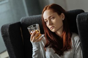 young woman showing signs of alcoholism