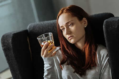 signs of alcoholism young woman showing signs of alcoholism