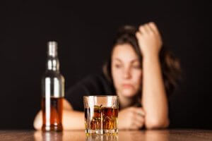 woman experiencing alcohol withdrawal symptoms new bridge foundation