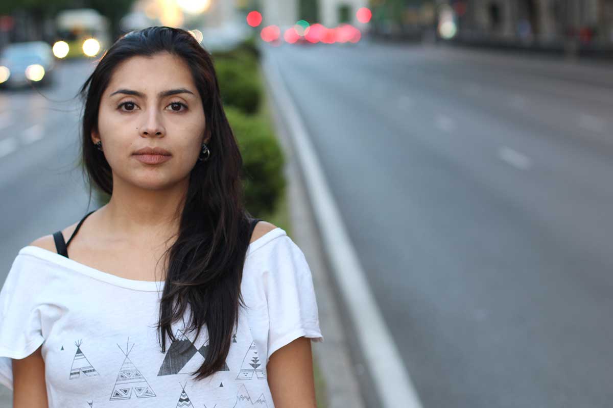opiates-vs-opioids young woman standing on road wondering the difference between opiates vs opioids