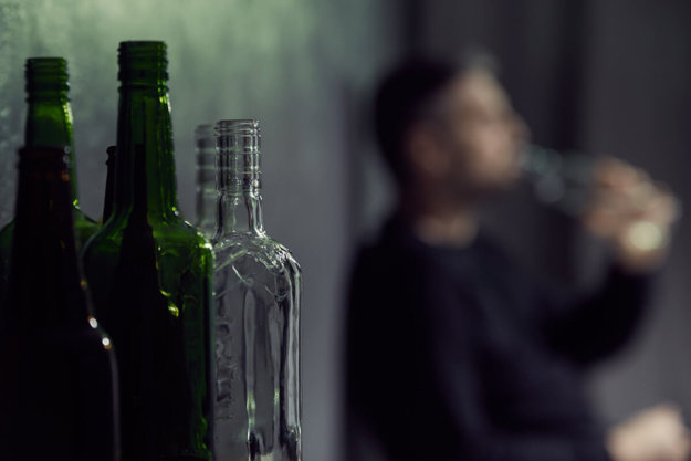 man struggles with alcohol addiction and considers virtual outpatient treatment