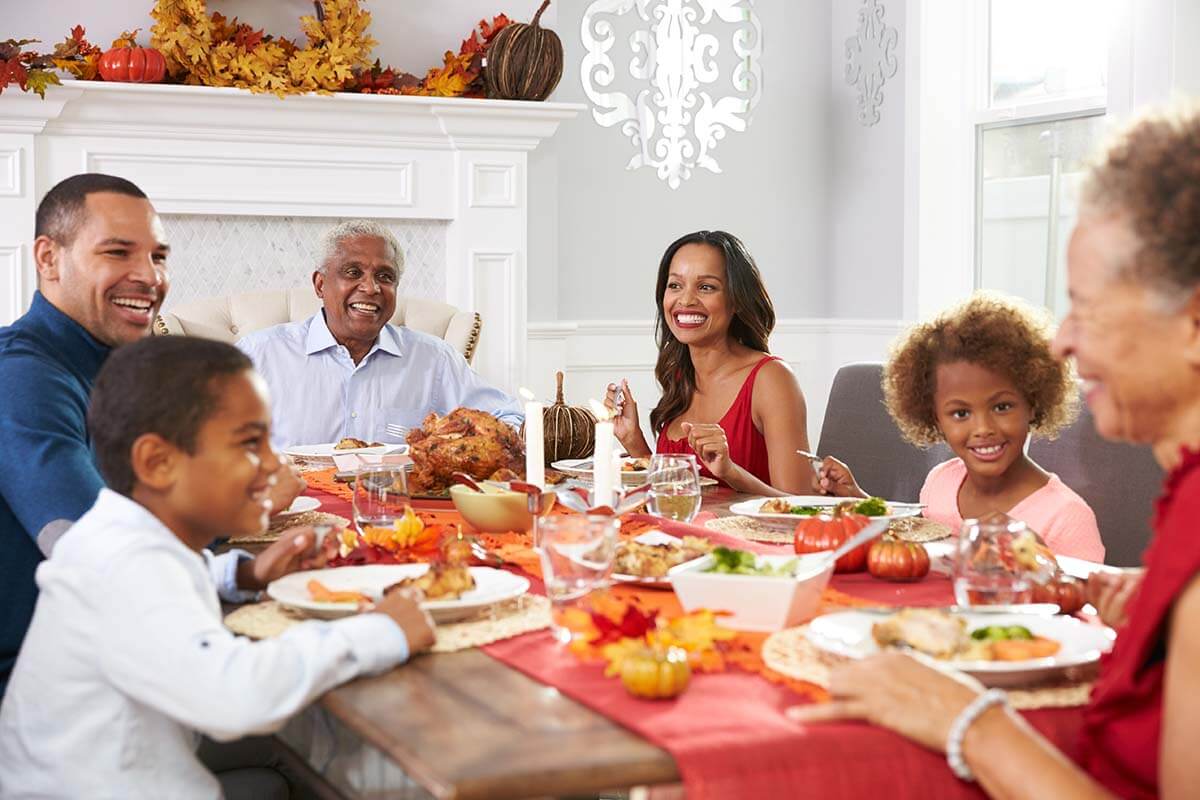 Family With Grandparents Enjoying Thanksgiving Meal At Table veteran family enjoys a sober thanksgiving
