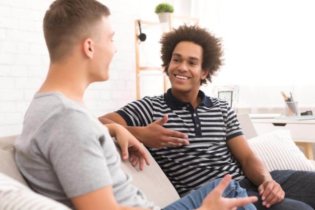 3 Benefits of LGBTQ Rehab Centers for Addiction Treatment two men conversing on a couch about LGBTQ rehab centers