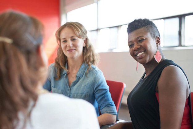 5 Characteristics of an Alcohol and Drug Rehab women smiling in group therapy in an alcohol and drug rehab
