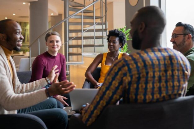 diverse group discussing alcohol rehab for veterans