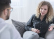 woman talks to a counselor about the benefits of long-term residential rehab