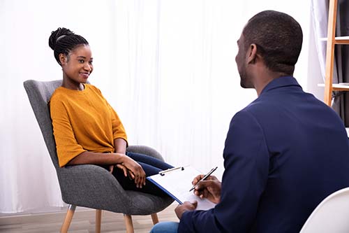 woman sitting in a comfortable chair in an individual therapy session during xanax addiction treatment