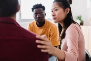 individuals in a group therapy session at an alcohol detox center