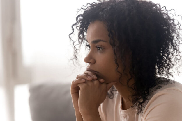 How Cocaine Impacts Your Mental Health woman with curly hair considers the effects of cocaine on mental health