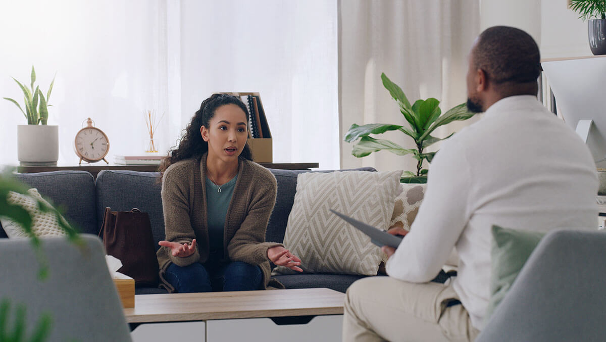 Residential Treatment for Addiction client talks with therapist about residential treatment for addiction