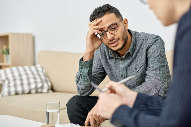 Long-Term vs Short-Term Residential Rehab man talks with counselor about long-term vs short-term rehab