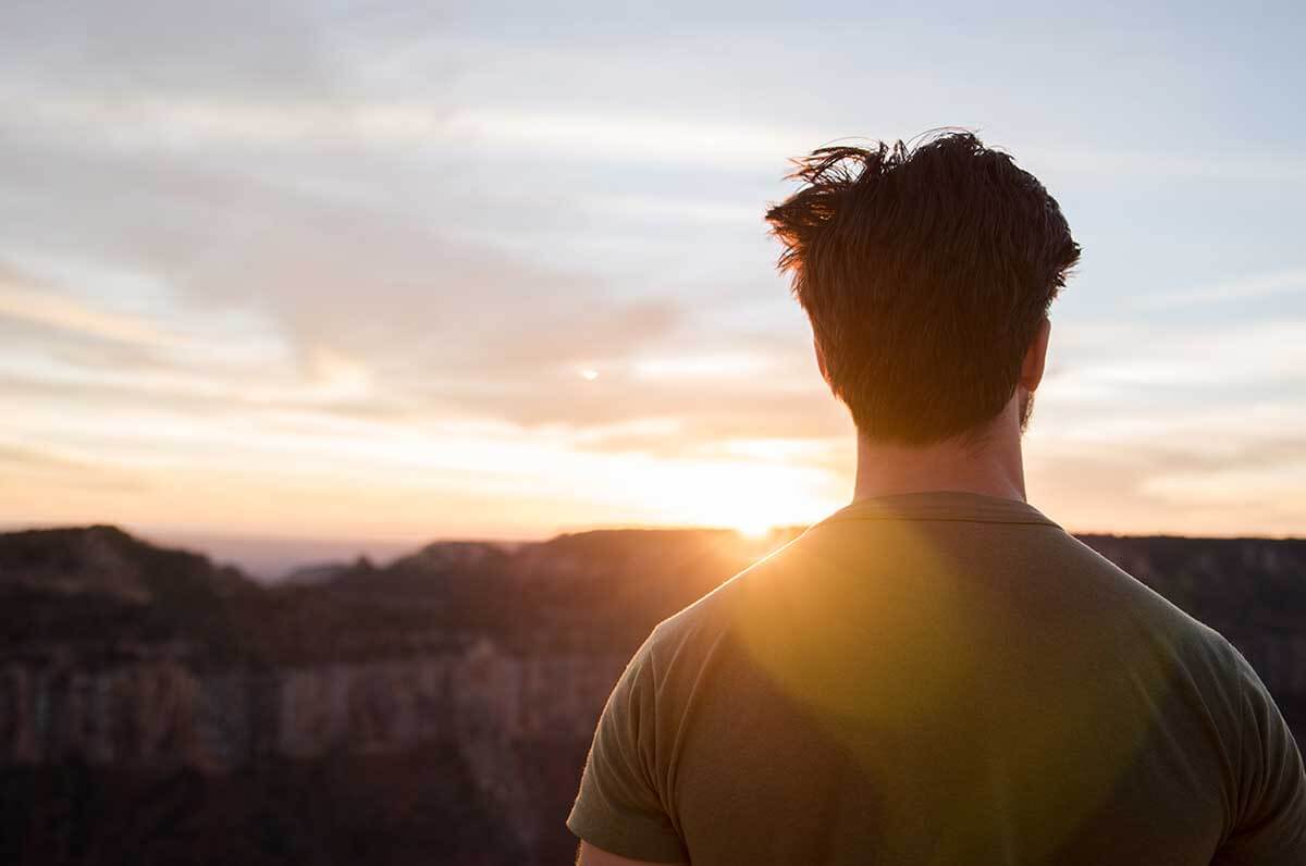 person looking out at the horizon considers how to prevent relapse