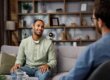 man talks with therapist about how outpatient rehab helps with long-term recovery