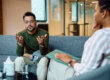 man talking with therapist about how long rehab takes