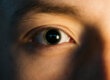 Face with large dilated pupils caused by drugs